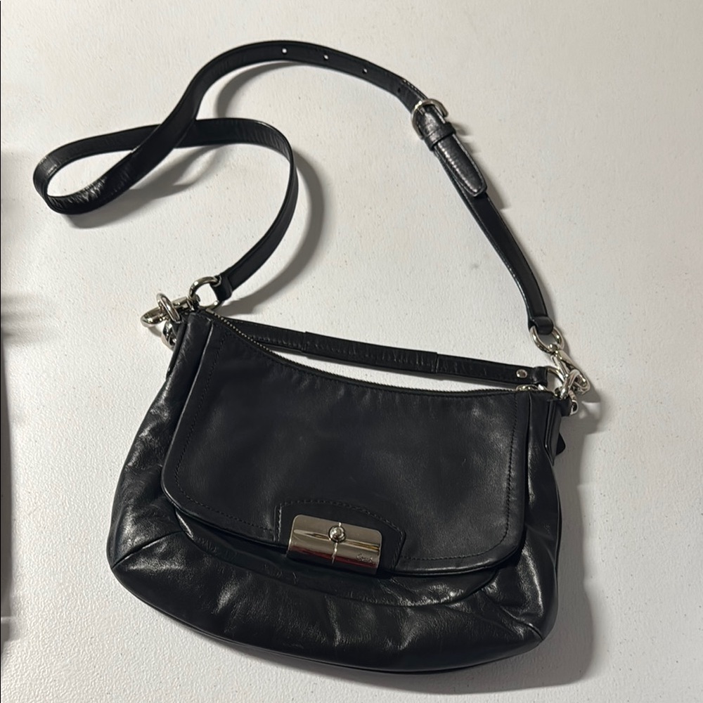 Coach Black Crossbody Bag with Adjustable Strap and Flap Closure